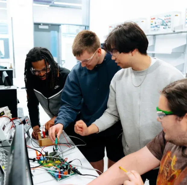 Two teammates debugging a prototype together